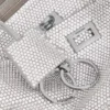 Dámská taška Rodeo Sling Pochette s kamínky v kouřově šedé barvě