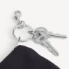 Pánská taštička na zip s přívěskem v černé barvě